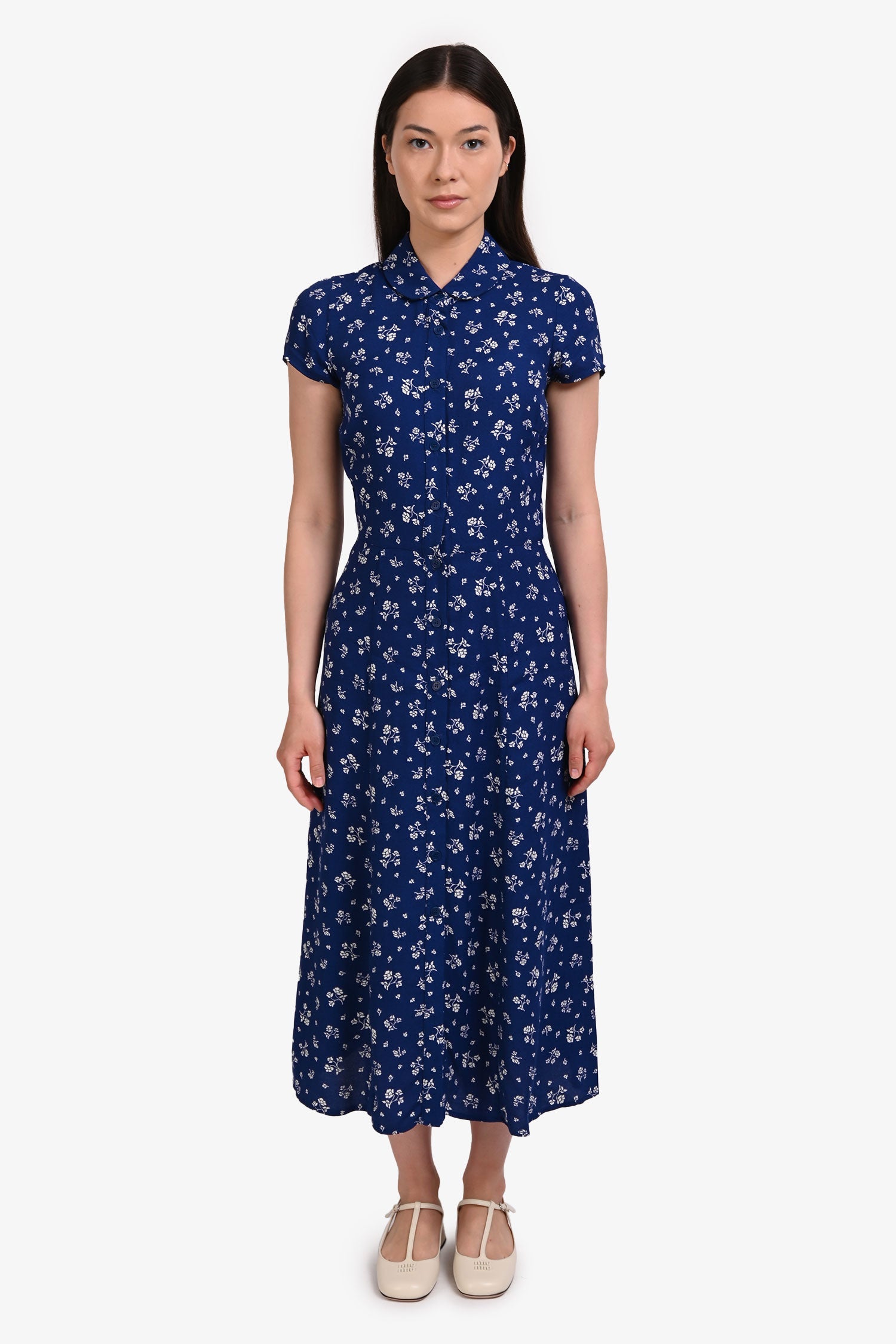 reformation blue and white floral dress and back smocking. Reformation Lilibet Floral Ruffle Trim